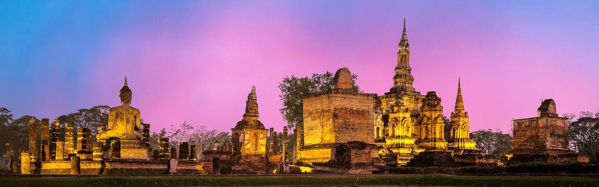 Iconic Buddha statues in Sukhothai for a vibrant Sukhothai Tours banner with Legend Travel Group.